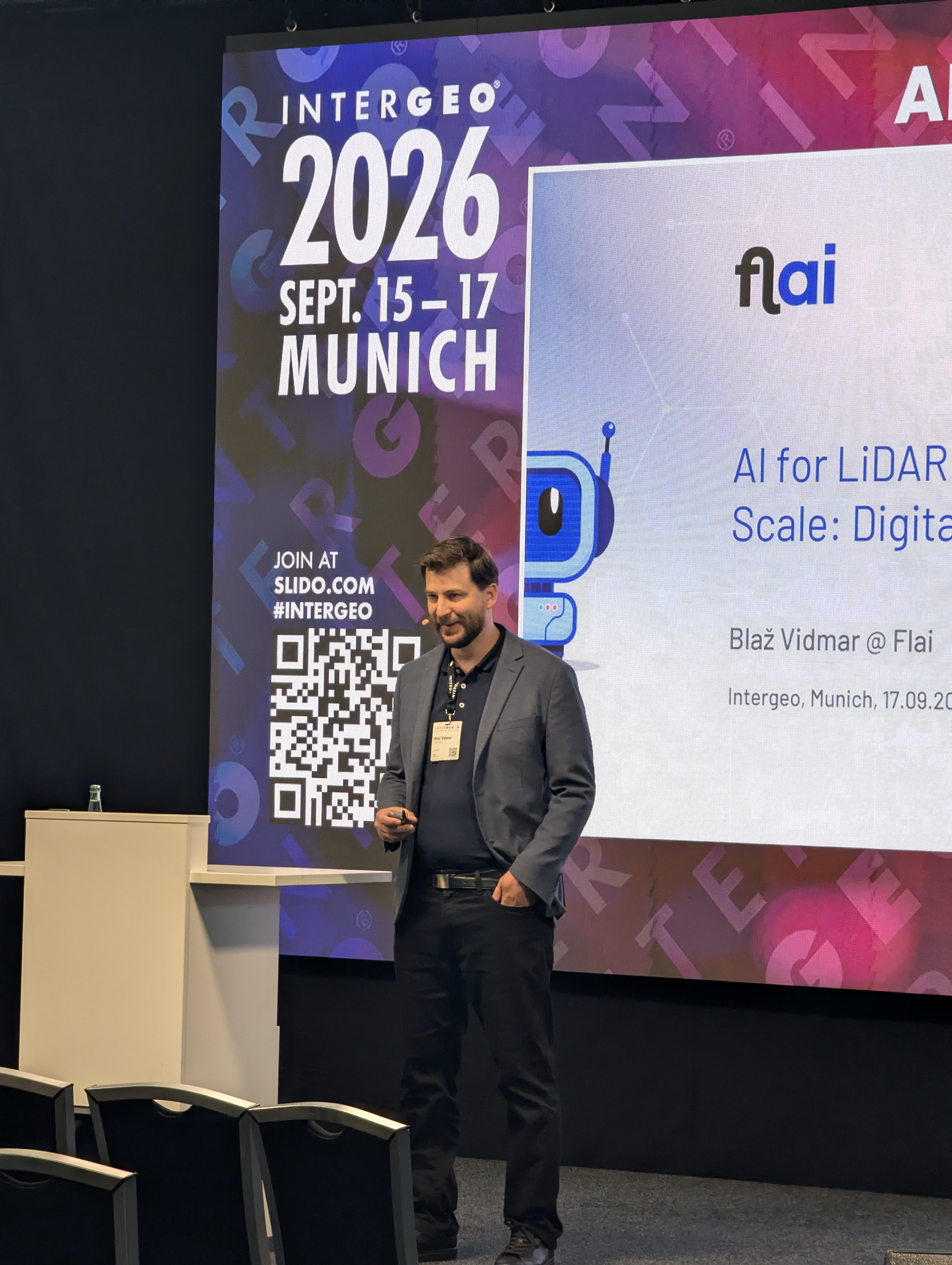 Blaž V. presenting Flai's session on AI-powered LiDAR classification at national scale, Intergeo 2026, Munich