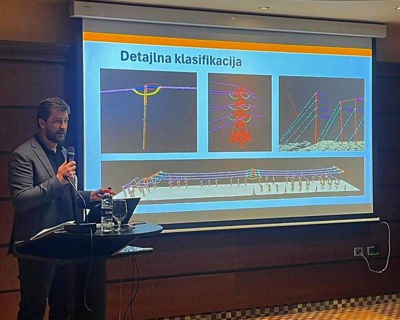 Blaž Vidmar presenting detailed classification of power line infrastructure, showing individual poles, lattice towers and conductors separated by class